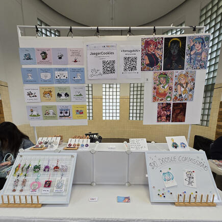 The table I shared at DPC Artist Alley with @Jaegercookies (right side is mine!) 2025.